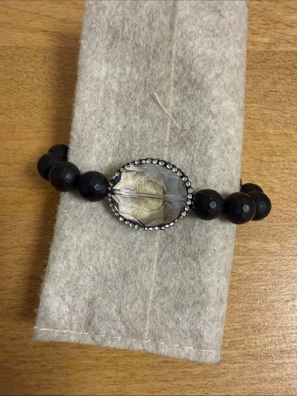 Black crystal beaded bracelet with large clear crystal accent